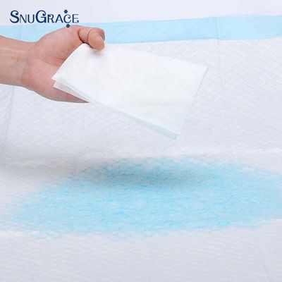 Pad para mascotas de tejido no tejido para entrenamiento de perros cachorros Pulpa de pelusa SAP Tejido PE Muestras gratuitas